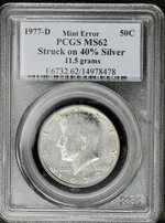 77d PCGS struck on silver.jpg