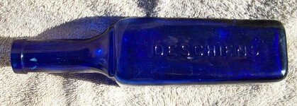 Deschiens Bottle Side One (700x251).jpg