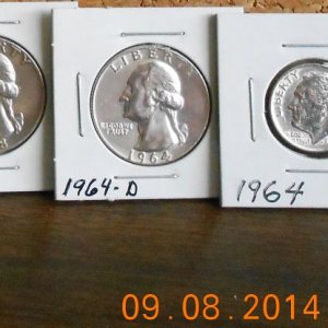 9-8-14 3 Silver coins found next to a lake parking lot.