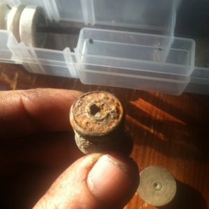 Backside of bullet, no clue what age it is. I suspect it's a shotgun slug.