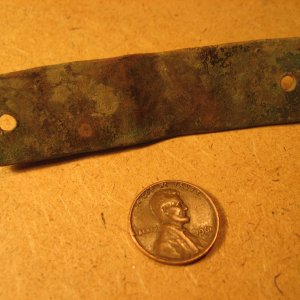Hand-stamped brass tag found on former farm site in eastern KS (back).