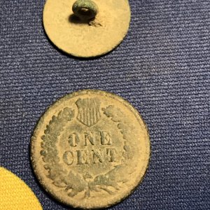 Rear of flat button and 1901 Indian Head Penny