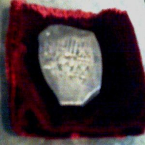Eight Reale - One of my most prized posessions.  This Piece of Eight silver coin, minted in Mexico before 1715, was recovered off the Florida Coast wh