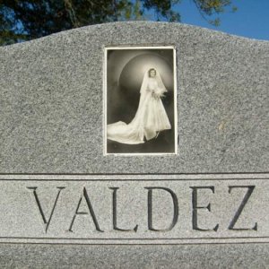 Remembered young - this lady is no relation,i just found this headstone very interesting. ive never seen one with a wedding photo like this before. th