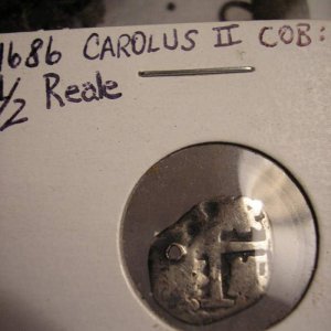 1686 Carolus II Cob - I dug this cob in 2008.  It was probably lost off of a thread as it has a hole through it.  In this day, they would keep money o
