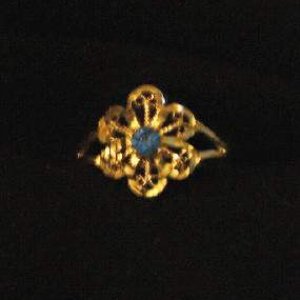 flower ring with blue stone
