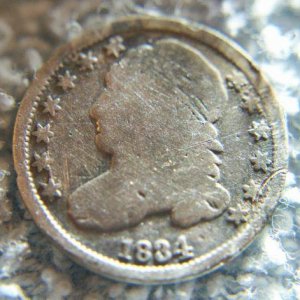 1834 Capped Bust Dime - Found this Capped Bust Dime in a farm field Feb 2011 it was 4 to 5" deep
The site where it was found was a former town that wa