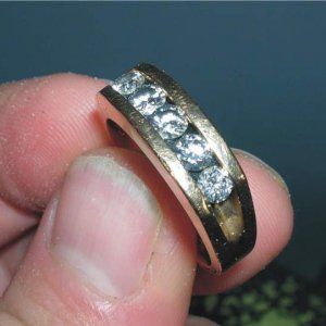 5 Diamond Gold Ring - This ring was returned to the owner.
The local paper did a front page article about me finding it.
This story is under the Honor