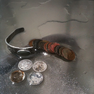 120 year old hunted out park 8-5-2012. 3 barbers one merc and a chunky piece of a native sterling bracelet