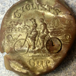 Cyclist Cup Lid. Circa 1885 Pott. Co.

Homestead west of twin lakes