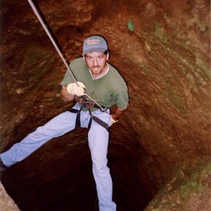 Rappelling into a silver mine.