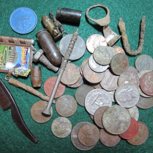 Accumulated stuff I found since starting my new metal detecting hobby. Of course I have found a huge amount of pull tabs, foil and bottle tops. The tr