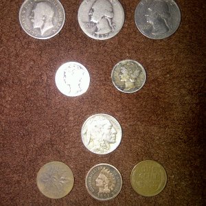 1914 king george one shilling...1937  quarter..1977 quarter..i know ..its not that old..but older than me..1935 and 42 liberty dimes.1928 buffalo nick