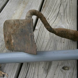 half a garden hoe, well worn and filed blade concave