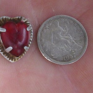 Strange heart pendant found in the same hole with the half dime.......