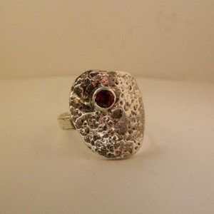 Abstract sterling silver and garnet ring