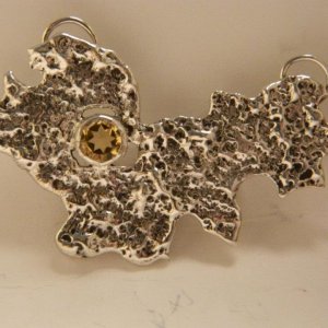 One of my favorites. Sterling silver abstract pendant with bezel set citrine.