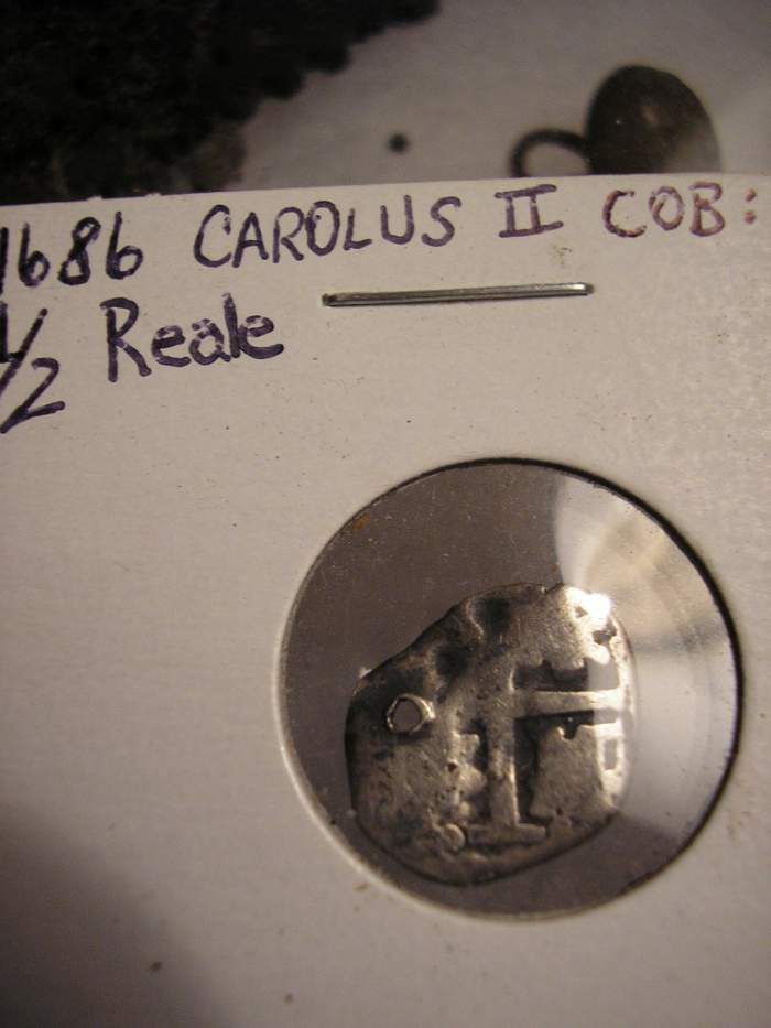 1686 Carolus II Cob - I dug this cob in 2008.  It was probably lost off of a thread as it has a hole through it.  In this day, they would keep money o