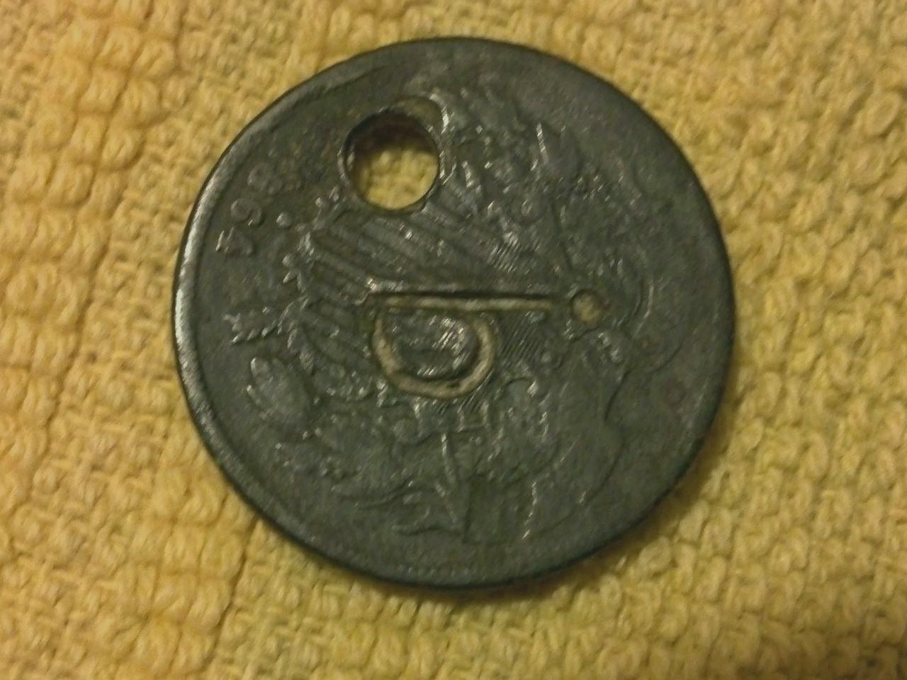 1864 2 cent with cannon stamped on it.