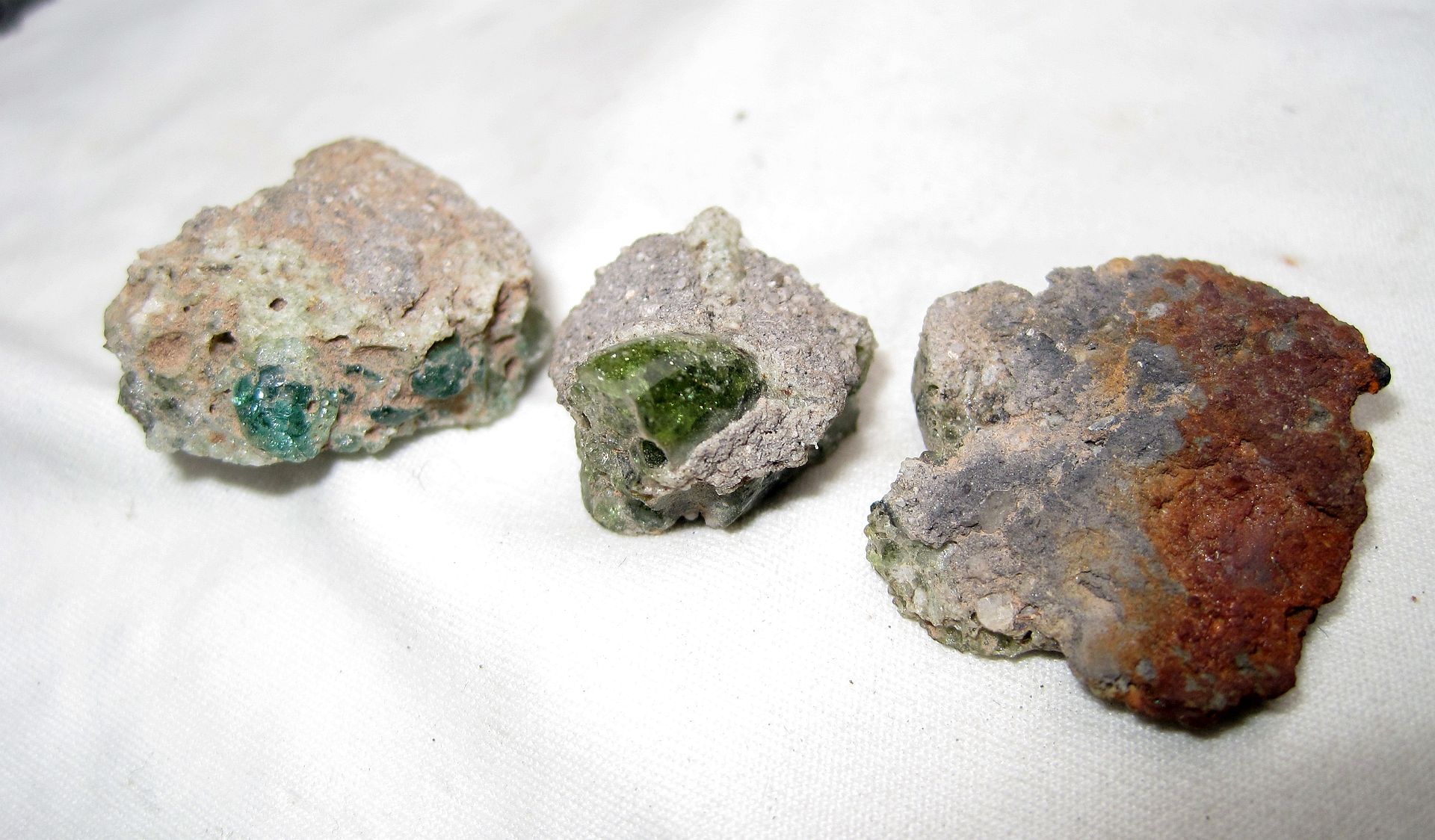 !945 Trinitite - The rusty piece (actual frame which held Trinity Atomic Bomb)
The Blue piece - rare variety Atomic glass