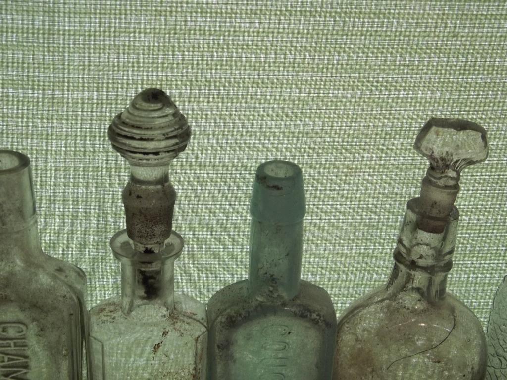 A few bottles with some glass stoppers that were surface finds found while detecting.