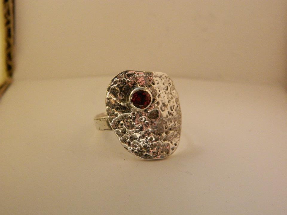 Abstract sterling silver and garnet ring