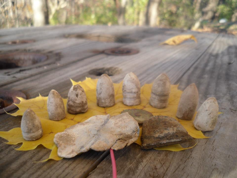 Assortment of bullets, some camp lead and a thimble.