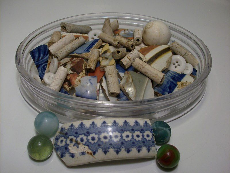 Colonial clay pipe stems, pottery and china, and some later marbles eyeballed in the fields.