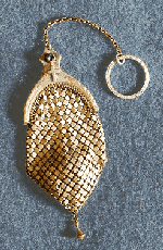 Extremely RARE - Tiny Brass Mesh Rosary Ring purse.
No makers mark, but suspect it is by Whiting & Davis. These are VERY RARE, with tiny brass rosary 