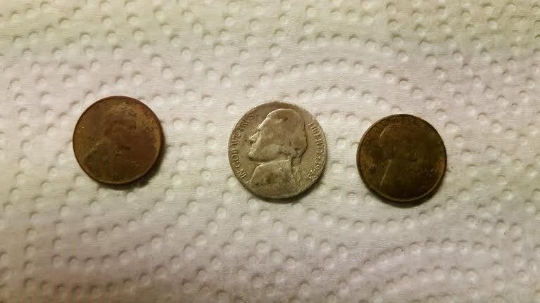 Front of two wheats and a war nickel.