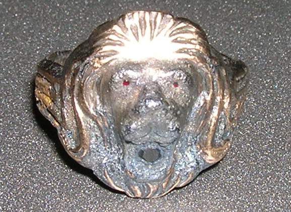 Lion Face Ring - This Lion face ring is made of brass & has rubys in his eyes & mouth.