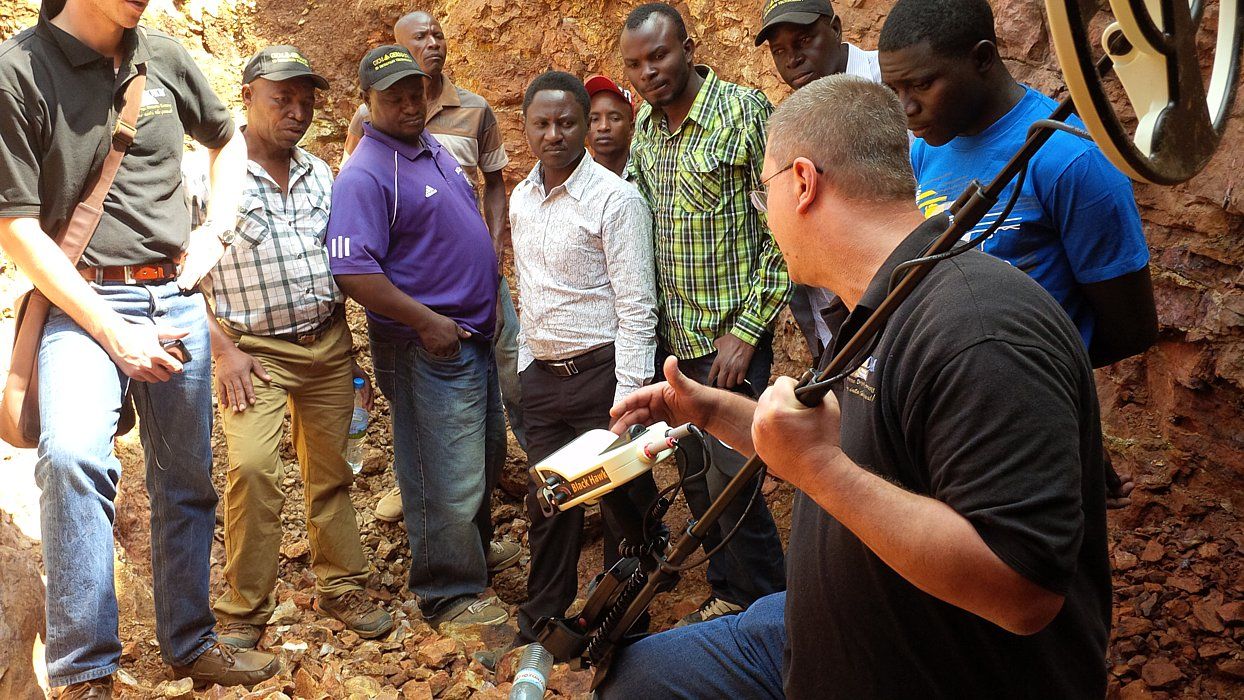 OKM field trainer answers questiond of gold seekers in Tanzania.