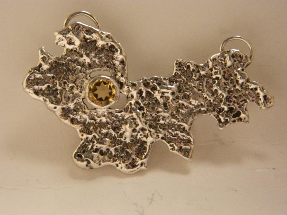 One of my favorites. Sterling silver abstract pendant with bezel set citrine.