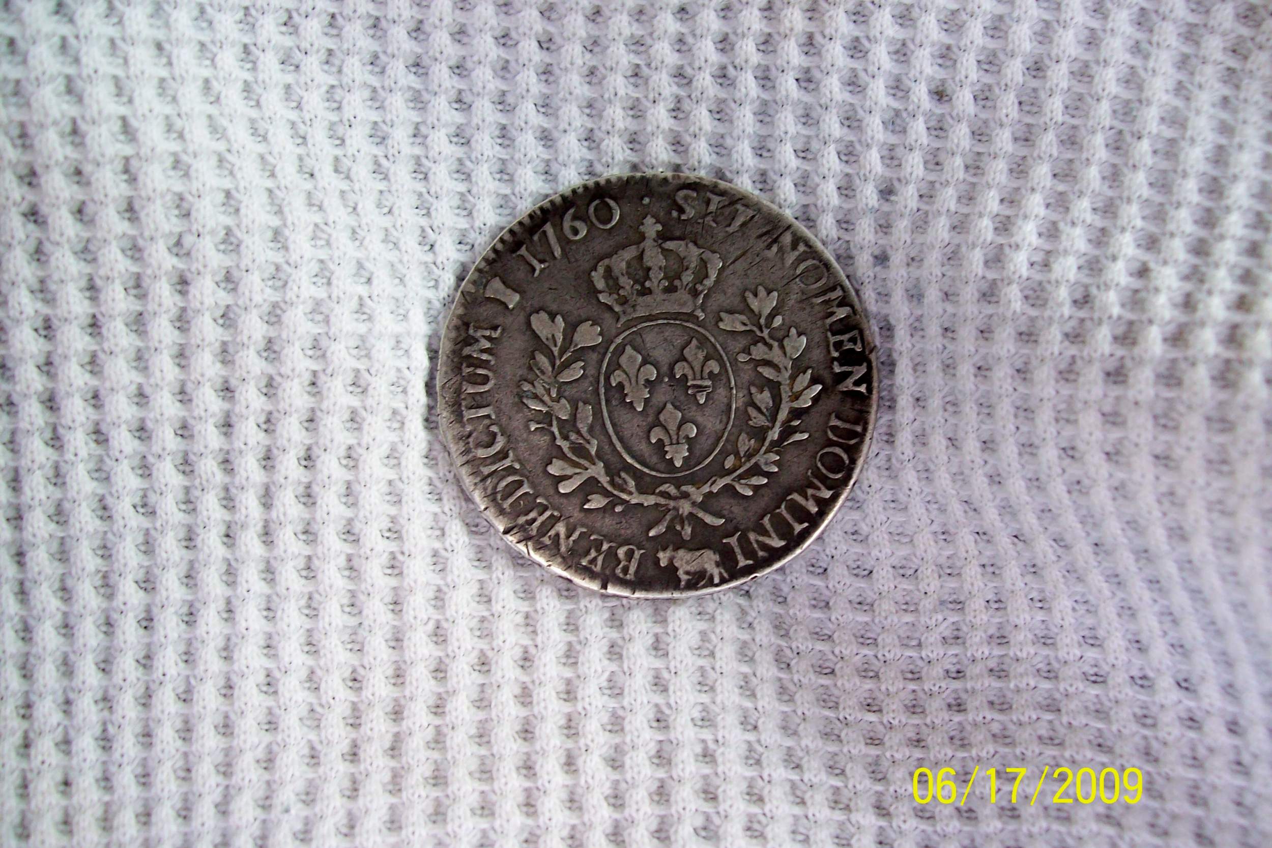 Reverse of 1760 coin i found it 8 inches deep - Iam not sure if this was minted in Canada ? its much bigger then a US silver dollar