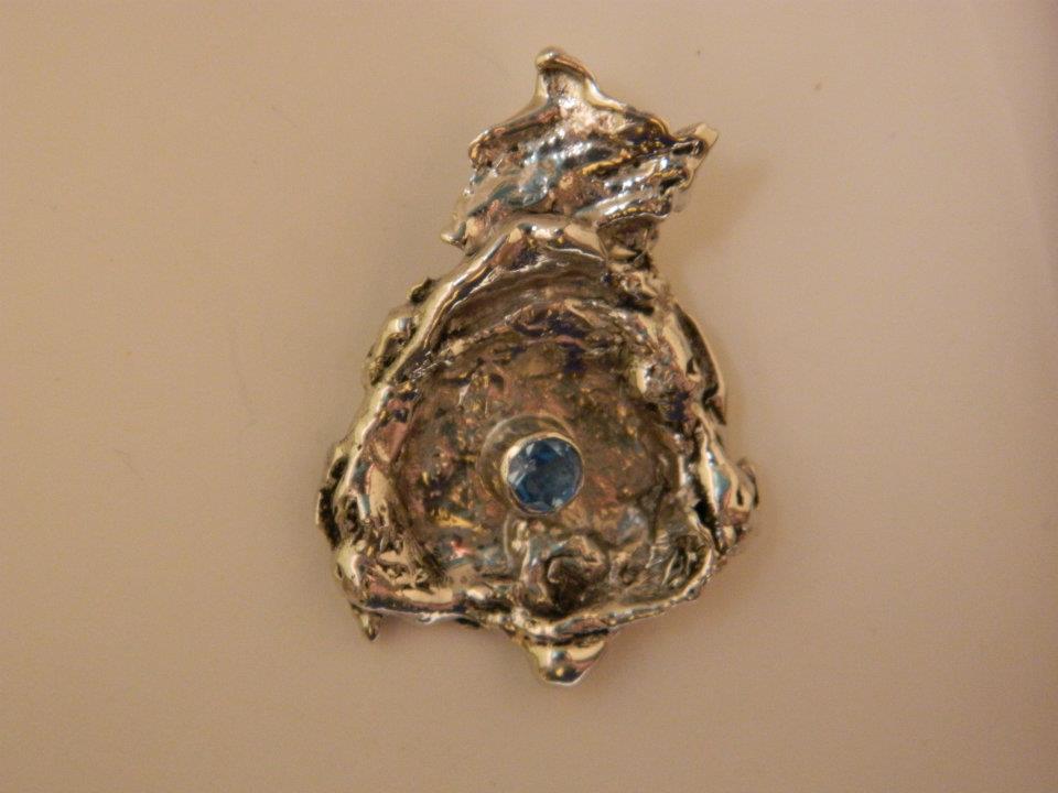 Water cast sterling silver pendant with swiss blue topaz