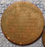 11 MI2 112214 Quincy Token Rev.webp