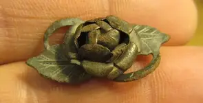 small copper brooch.webp
