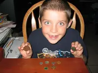 Kyle gets some coins for his collection.webp