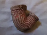 red pottery pipe.webp
