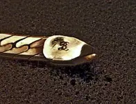 Necklace1DarkLogoDistinct.webp