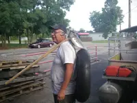 straight handled scoop with sifter on shoulder resized.webp