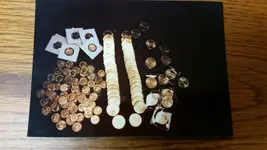 lots of old gold coins.webp