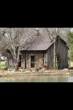 Old house on pond.webp