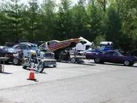 Dragsters and a Boat.webp