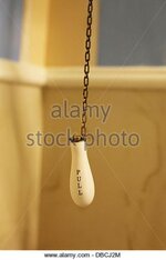 an-old-fashioned-pull-chain-flusher-for-an-old-toilet-dbcj2m.jpg