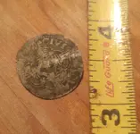 cropped hammered silver coin.webp