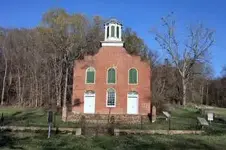 rodney Confederate Earthworks on Highground behind church.webp