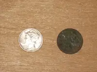 Winged Liberty (1942) and a toasted Memorial Cent.webp