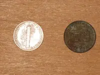 Winged Liberty Dime and a toaster Memorial Cent Reverse.webp
