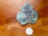 front of brass buckel or clip.webp